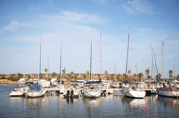 Obraz na płótnie Canvas Docked ships at marine bay in a Spanish town. High-quality photo