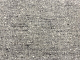 Grey tweed cloth texture, gray wool pattern. Textured fabric background of gray fabric. Grey wool textile.