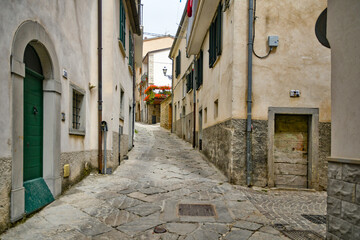 Small street between the old houses of Agnone, a medieval village in the mountains of Molise region