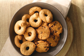 Plate of sugar cookies and chocolate chip cookies on the table. Flat lay.