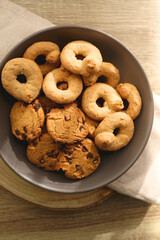 Plate of sugar cookies and chocolate chip cookies on the table. Flat lay.