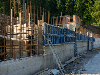 Reinforcing foundation for a building in a mountainous area. Wall formwork casting reinforced...
