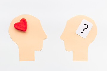 Brain and heart - logic and emotion. Communication between two paper human heads