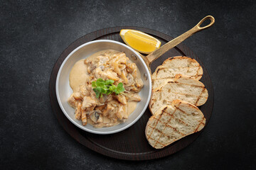 Rapani in a creamy sauce with lemon and toast