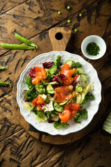 Healthy vegetable salad with smoked salmon