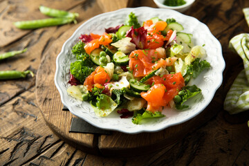 Healthy vegetable salad with smoked salmon