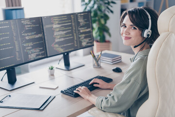 Profile side view portrait of attractive cheery girl expert specialist coding html task talking client at work place station indoors - obrazy, fototapety, plakaty