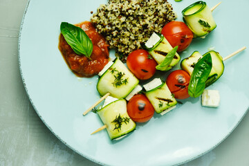 Zucchini skewers with feta and quinoa