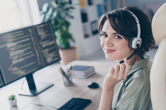 Profile side view portrait of attractive cheery confident girl expert coding solving task issue qa talking client at work place station indoors