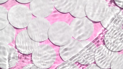 Single wave of water creates ripples on pink background with cotton pads | Background shot for facial cleanser or micellar water commercial