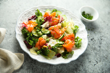 Healthy vegetable salad with smoked salmon