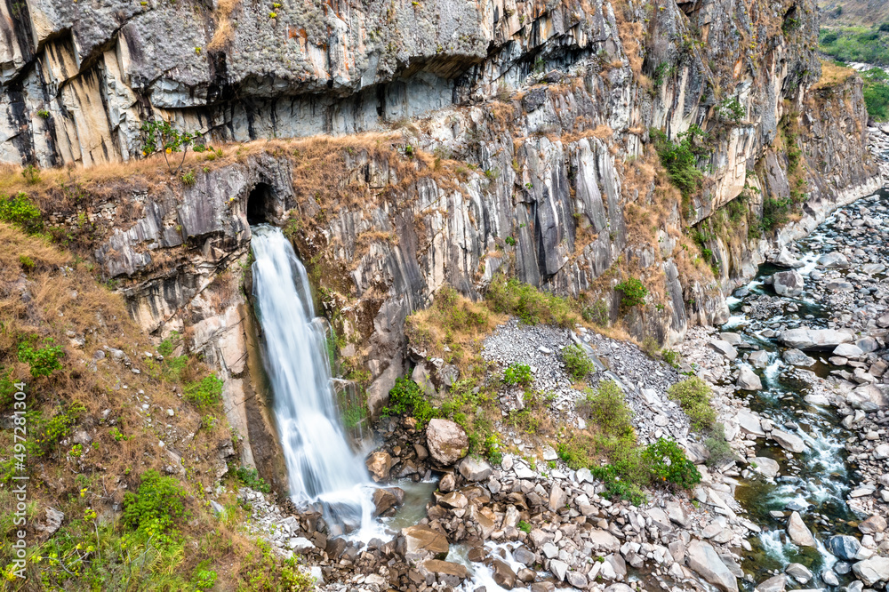 Sticker Cave waterfall at the Urubamba river near Machu Picchu in Peru