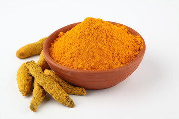 Indian spices, Turmeric powder or haldi powder in terracotta bowl