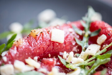 Marbled beef carpaccio with arugula and parmesan cheese