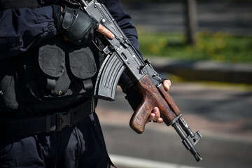 A special forces soldier holding his automatic rifle during an incident