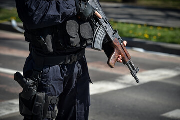 A special forces soldier holding his automatic rifle during an incident