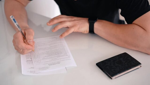 a man fills out paperwork, world donor day, polyclinic