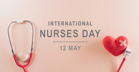 Top view of doctor stethoscope and red heart with the text on pastel background. International nurse day and medical concept.