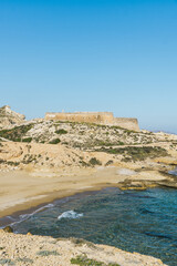 Vertical photo of San Ram&oacute;n Castle and Rodalquilar Beach in Cabo de Gata Natural Park, Almer&iacute;a, Spain.