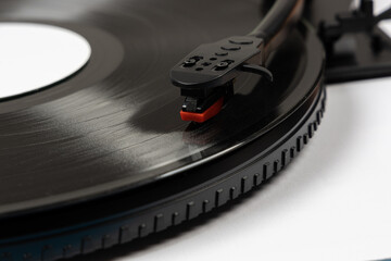 Vinyl turntable with vinyl plate. Modern gramophone record player. Retro sound technology to play...