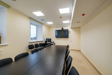  rows of seats in interior of modern empty conference hall for business meetings