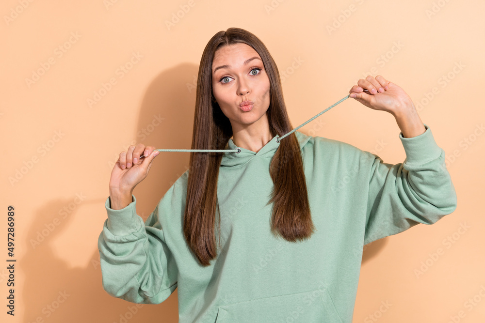 Wall mural Portrait of attractive comic cheerful brown-haired girl fooling pout lips isolated over beige pastel color background