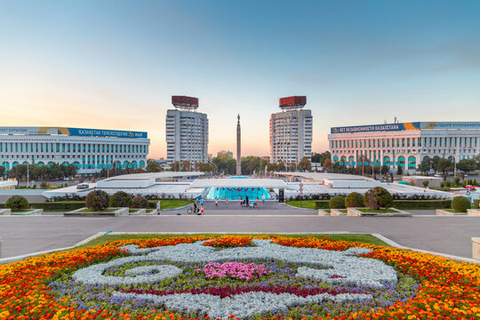 Almaty Republic Square with flower bed and independence monument