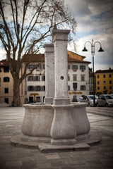 Ancient Fountain on Saint Antonio Square Gorizia - obrazy, fototapety, plakaty