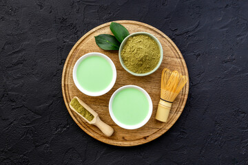 Tea ceremony with matcha powder and hot drink, top view