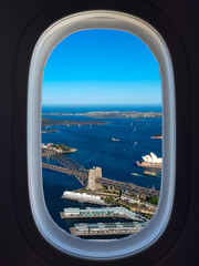Airplane window view of Sydney Harbour NSW Australia beautiful bridge with Sydney CBD office and...