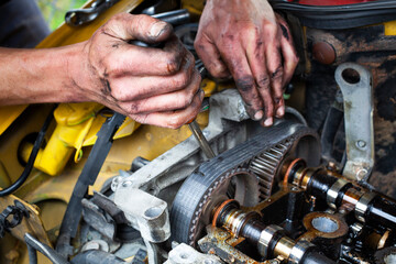 Fototapeta premium Mechanic Working On Replacing Engine Belt close up