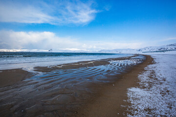 Shore near Teriberka. Barents Sea bay winter landscape. Russia.