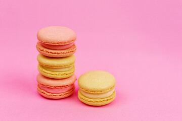 macaroons on a pink background with a place for writing and cutting. Minimalism.