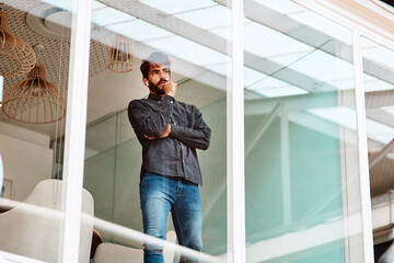Pondering over his next great achievement. Shot of a young businessman looking thoughtful while...
