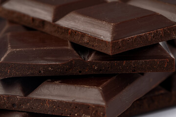 Milk chocolate bars stack for background, close up