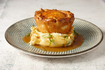 close up of a gourmet pie and mash.