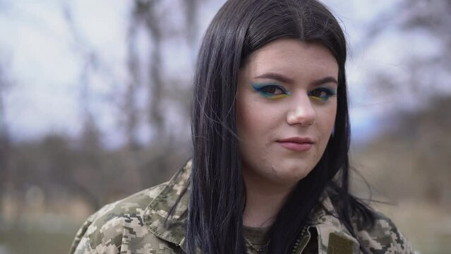 A girl in military uniform. Weapons forces of Ukraine.