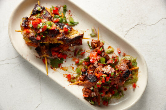 Lamb kebabs with garnish