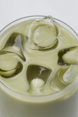 Fresh matcha latte with ice, close-up