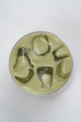 Fresh matcha latte with ice, close-up