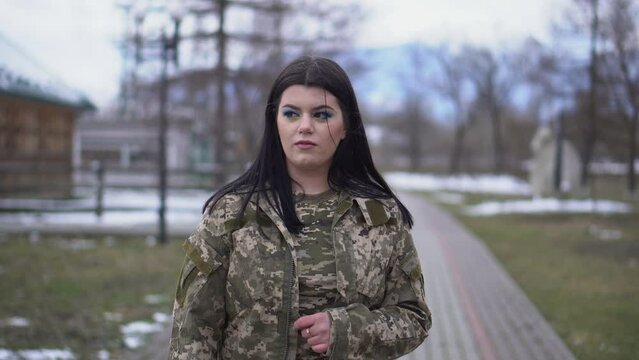 A girl in military uniform. Weapons forces of Ukraine.