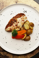 Grilled salmon and baked vegetable on a white plate