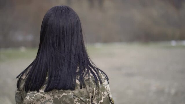 A girl in military uniform. Weapons forces of Ukraine.