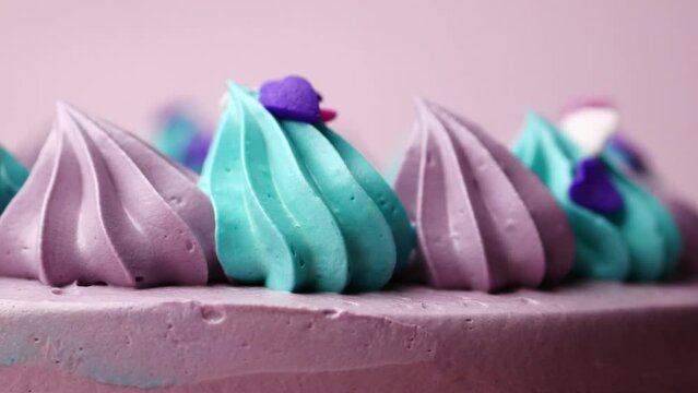 purple and green color birthday cake on color backgorund 