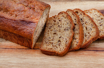 freshly baked rustic style banana bread loaf on country style table