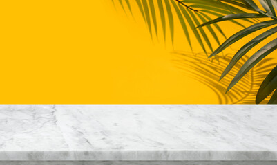 Selective focus.Nature product display with marble table counter on palm leaf color background