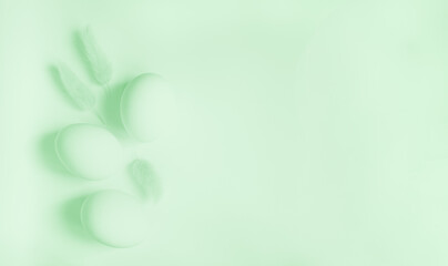 Easter composition. Eggs and spikelets of dried bunny tail grass (lagurus ovatus). Monochrome flat...