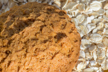 Homemade oatmeal cookies close-up. Dry breakfasts for children. Rolled oat, oat flakes background or texture.