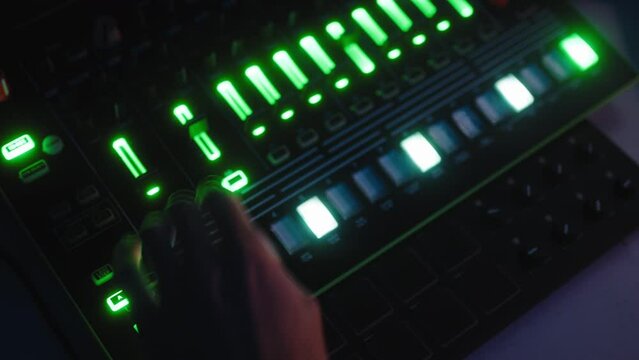 music producer working on drum machine 