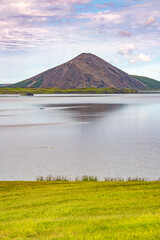 Vindbelgjarfjall mount and volcano at Myvatn lake near Reykjahlid in Northern Iceland, at summer time, at sunset.